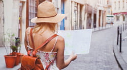 Woman looking at map in the street
